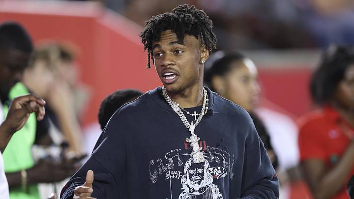 Sep 12, 2025; Houston, Texas, USA; Houston Texans wide receiver Tank Dell talks on the sideine during the game between the Houston Cougars and the Colorado Buffaloes at TDECU Stadium. Mandatory Credit: Troy Taormina-Imagn Images
