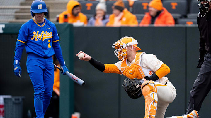 Tennessee's Stone Lawless (27) motions to teammates out on the field during a college baseball game between Tennessee and Hofstra at Lindsey Nelson Stadium in Knoxville on Sunday, Feb. 16, 2025.