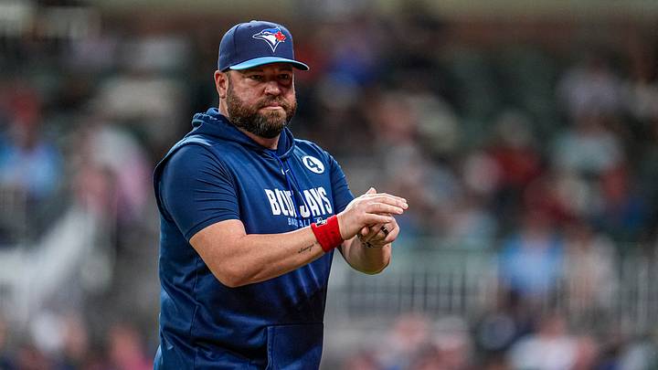 Blue Jays manager John Schneider (14) on the field against the Atlanta Braves Blue Jays manager John Schneider (14) on the field against the Atlanta Braves