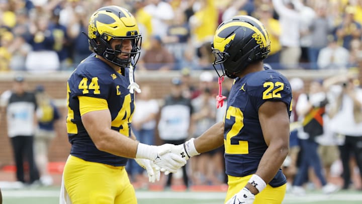 Sep 13, 2025; Ann Arbor, Michigan, USA;  Michigan Wolverines running back Justice Haynes (22) receives congratulations from tight end Max Bredeson (44) after scoring in the first half against the Central Michigan Chippewas at Michigan Stadium. Mandatory Credit: Rick Osentoski-Imagn Images