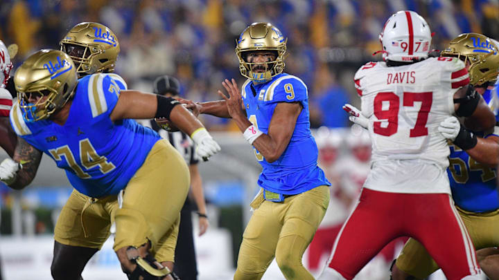 Nov 8, 2025; Pasadena, California, USA; UCLA Bruins quarterback Nico Iamaleava (9) throws against the Nebraska Cornhuskers during the first half at the Rose Bowl. Mandatory Credit: Gary A. Vasquez-Imagn Images