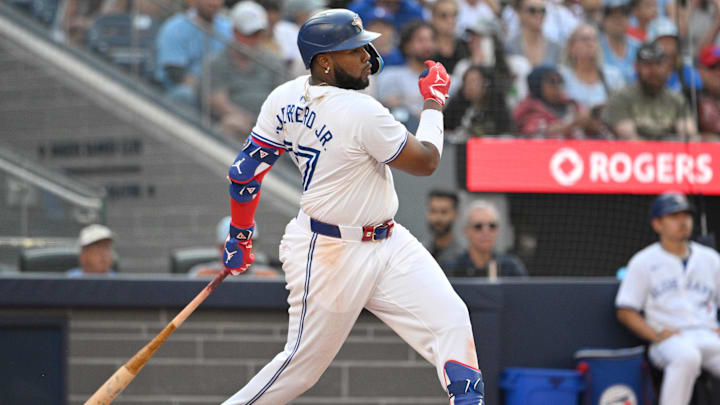 Toronto Blue Jays first baseman Vladimir Guerrero Jr. (27) hits an RBI single against the St. Louis Cardinals in the seventh inning at Rogers Centre. It was the 500th RBI of his career in 2024.