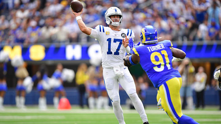 Sep 28, 2025; Inglewood, California, USA; Indianapolis Colts quarterback Daniel Jones (17) throws under pressure from Los Angeles Rams defensive end Kobie Turner (91) during the first half at SoFi Stadium. Mandatory Credit: Gary A. Vasquez-Imagn Images Sep 28, 2025; Inglewood, California, USA; Indianapolis Colts quarterback Daniel Jones (17) throws under pressure from Los Angeles Rams defensive end Kobie Turner (91) during the first half at SoFi Stadium. Mandatory Credit: Gary A. Vasquez-Imagn Images
