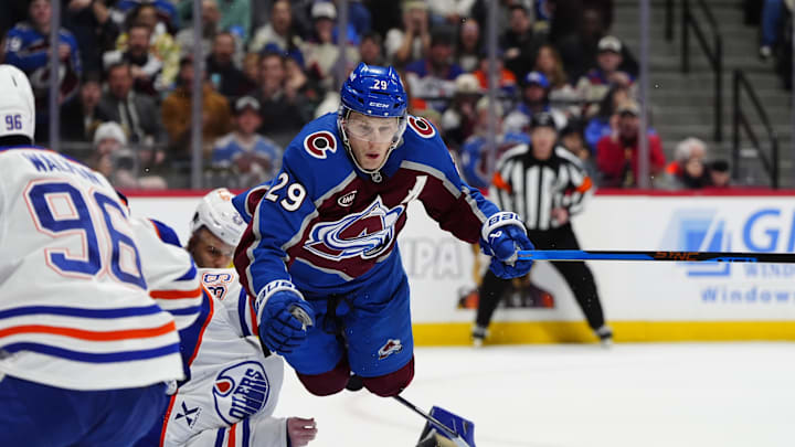 Mar 10, 2026; Denver, Colorado, USA; Colorado Avalanche center Nathan MacKinnon (29) collides into Edmonton Oilers goaltender Connor Ingram (39) in the second period at Ball Arena. Mandatory Credit: Ron Chenoy-Imagn Images