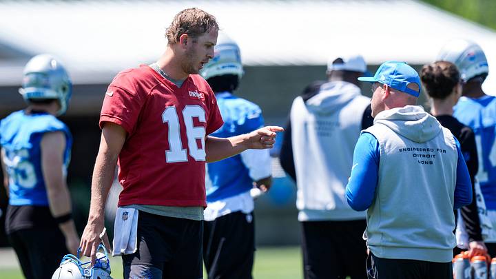 Detroit Lions quarterback Jared Goff (16), left, talks to offensive coordinator Drew Petzing during OTAs at Meijer Performance Center in Allen Park on Friday, May 29, 2026.