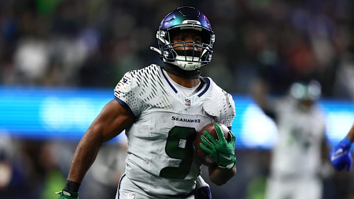 Dec 18, 2025; Seattle, Washington, USA; Seattle Seahawks running back Kenneth Walker III (9) runs to score a touchdown against the Los Angeles Rams  in the second half at Lumen Field. Mandatory Credit: Kevin Ng-Imagn Images