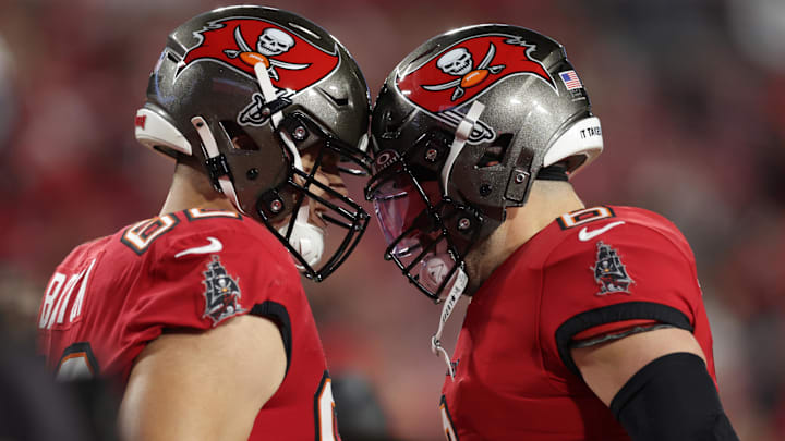Jan 12, 2025; Tampa, Florida, USA; Tampa Bay Buccaneers center Graham Barton (62) and quarterback Baker Mayfield (6) warm up before a NFC wild card playoff against the Washington Commanders at Raymond James Stadium. Mandatory Credit: Nathan Ray Seebeck-Imagn Images