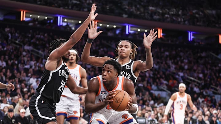 Nov 17, 2024; New York, New York, USA;  New York Knicks forward OG Anunoby (8) is double teamed by Brooklyn Nets guard Cam Thomas (24) and forward Noah Clowney (21) in the third quarter at Madison Square Garden. Mandatory Credit: Wendell Cruz-Imagn Images