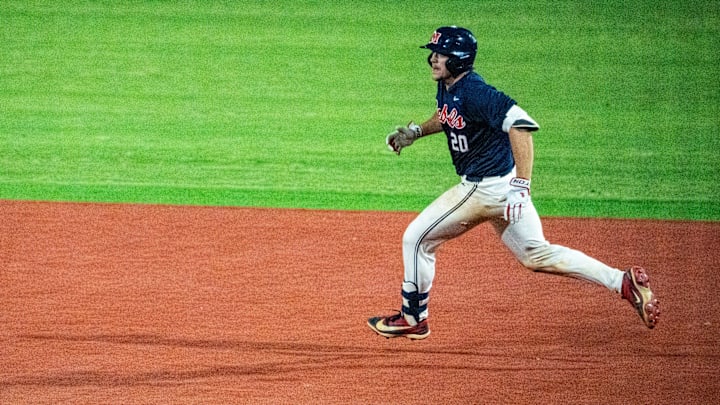Ole Miss catcher Collin Reuter (20) runs for second base during a college baseball game between Mississippi State and Ole Miss at Trustmark Park in Pearl, Miss., on Tuesday, April 28, 2026. Mississippi State defeated Ole Miss in the Governor’s Cup 7-3. Ole Miss catcher Collin Reuter (20) runs for second base during a college baseball game between Mississippi State and Ole Miss at Trustmark Park in Pearl, Miss., on Tuesday, April 28, 2026. Mississippi State defeated Ole Miss in the Governor’s Cup 7-3.