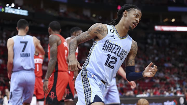 Memphis Grizzlies guard Ja Morant (12) reacts after making a basket during the first quarter against the Houston Rockets at Toyota Center. Mandatory Credit: Troy Taormina-Imagn Images