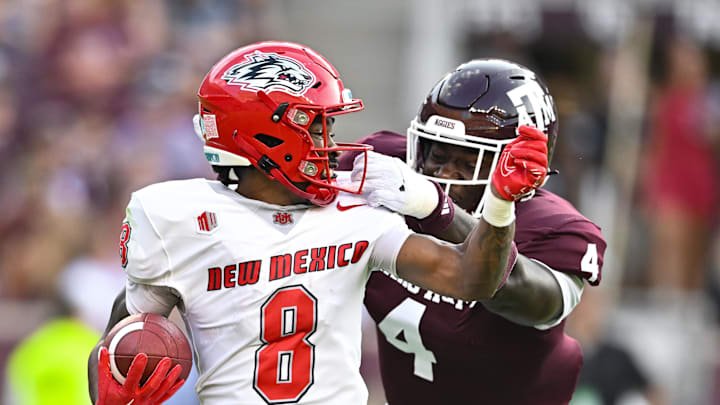 Sep 2, 2023; College Station, Texas, USA; New Mexico Lobos wide receiver Jeremiah Hixon (8) runs the ball during the second quarter as Texas A&M Aggies defensive lineman Shemar Stewart (4) makes a tackle at Kyle Field. Mandatory Credit: Maria Lysaker-Imagn Images Sep 2, 2023; College Station, Texas, USA; New Mexico Lobos wide receiver Jeremiah Hixon (8) runs the ball during the second quarter as Texas A&M Aggies defensive lineman Shemar Stewart (4) makes a tackle at Kyle Field. Mandatory Credit: Maria Lysaker-Imagn Images