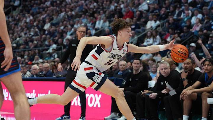 Jan 10, 2026; Hartford, Connecticut, USA; UConn Huskies guard Braylon Mullins (24) saves the ball against the DePaul Blue Demons in the second half at PeoplesBank Arena. Mandatory Credit: David Butler II-Imagn Images