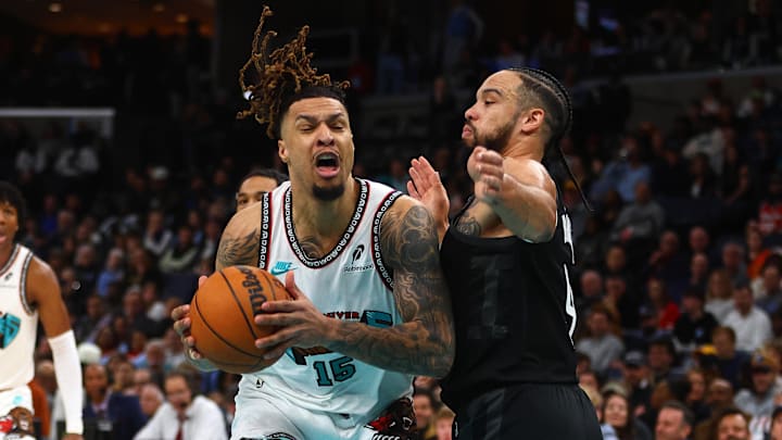 Jan 30, 2025; Memphis, Tennessee, USA; Memphis Grizzlies forward Brandon Clarke (15) drives to the basket as Houston Rockets forward Dillon Brooks (9) defends during the first quarter at FedExForum. Mandatory Credit: Petre Thomas-Imagn Images