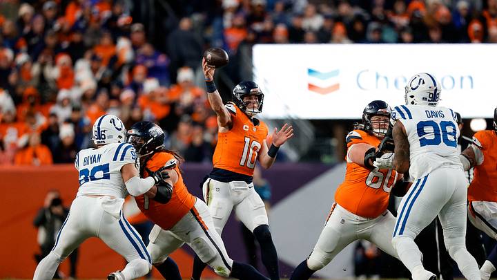 Dec 15, 2024; Denver, Colorado, USA; Denver Broncos quarterback Bo Nix (10) attempts a pass as guard Quinn Meinerz (77) defends against Indianapolis Colts defensive tackle Taven Bryan (96) and center Luke Wattenberg (60) defends against defensive tackle Raekwon Davis (98) in the third quarter at Empower Field at Mile High. Mandatory Credit: Isaiah J. Downing-Imagn Images Dec 15, 2024; Denver, Colorado, USA; Denver Broncos quarterback Bo Nix (10) attempts a pass as guard Quinn Meinerz (77) defends against Indianapolis Colts defensive tackle Taven Bryan (96) and center Luke Wattenberg (60) defends against defensive tackle Raekwon Davis (98) in the third quarter at Empower Field at Mile High. Mandatory Credit: Isaiah J. Downing-Imagn Images