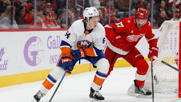Nov 20, 2025; Detroit, Michigan, USA; New York Islanders center Calum Ritchie (64) skates with the puck defended by Detroit Red Wings left wing J.T. Compher (37) in the first period at Little Caesars Arena. Mandatory Credit: Rick Osentoski-Imagn Images Nov 20, 2025; Detroit, Michigan, USA; New York Islanders center Calum Ritchie (64) skates with the puck defended by Detroit Red Wings left wing J.T. Compher (37) in the first period at Little Caesars Arena. Mandatory Credit: Rick Osentoski-Imagn Images