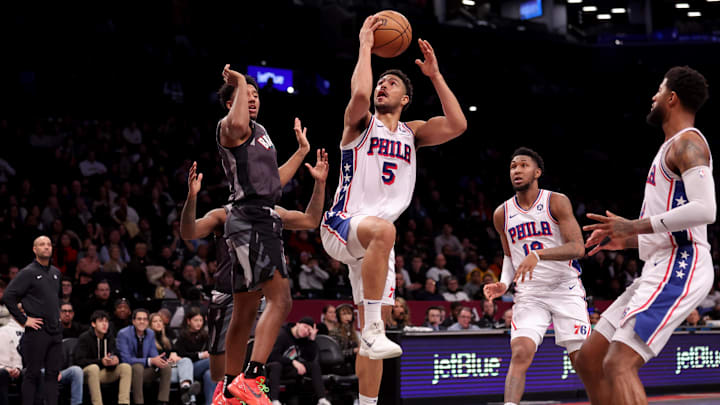 Feb 12, 2025; Brooklyn, New York, USA; Philadelphia 76ers guard Quentin Grimes (5) drives to the basket against Brooklyn Nets guard Reece Beekman (4) during the fourth quarter at Barclays Center. Mandatory Credit: Brad Penner-Imagn Images Feb 12, 2025; Brooklyn, New York, USA; Philadelphia 76ers guard Quentin Grimes (5) drives to the basket against Brooklyn Nets guard Reece Beekman (4) during the fourth quarter at Barclays Center. Mandatory Credit: Brad Penner-Imagn Images