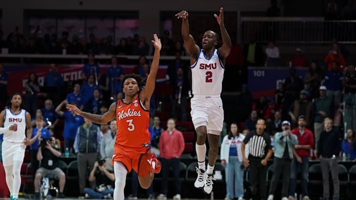 Jan 14, 2026; Dallas, Texas; SMU guard Boopie Miller (2) follows through on a game-winning half-court shot as Virginia Tech guard Ben Hammond (3) defends.