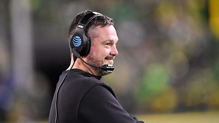 Dec 20, 2025; Eugene, OR, USA;  Oregon Ducks head coach Dan Lanning smiles during the third quarter against the James Madison Dukes at Autzen Stadium. 