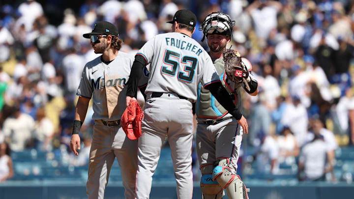 Miami Marlins pitcher Calvin Faucher celebrates a win with catcher Liam Hicks 