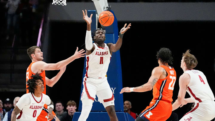 Nov 20, 2024; Birmingham, AL, USA; Alabama center Clifford Omoruyi (11) grabs a rebound from Illinois center Tomislav Ivisic (13) in the CM Newton Classic at Legacy Arena. Mandatory Credit: Gary Cosby Jr.-Tuscaloosa News