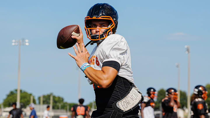 Cocoa quarterback Champ Smith passes the ball during fall practice in late July. The transfer quarterback led the Tigers to a 30-24 double-overtime victory last week against Merritt Island.