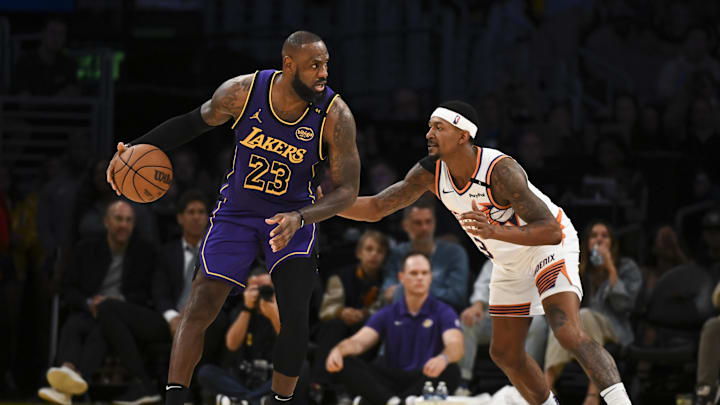 Oct 25, 2024; Los Angeles, California, USA; Los Angeles Lakers forward LeBron James (23) looks to pass against Phoenix Suns guard Bradley Beal (3) during the second half at Crypto.com Arena. Mandatory Credit: Jonathan Hui-Imagn Images