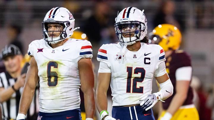 Nov 28, 2025; Tempe, Arizona, USA; Arizona Wildcats linebacker Taye Brown (6) and defensive back Genesis Smith (12) against the Arizona State Sun Devils during the 99th Territorial Cup at Mountain America Stadium. Mandatory Credit: Mark J. Rebilas-Imagn Images