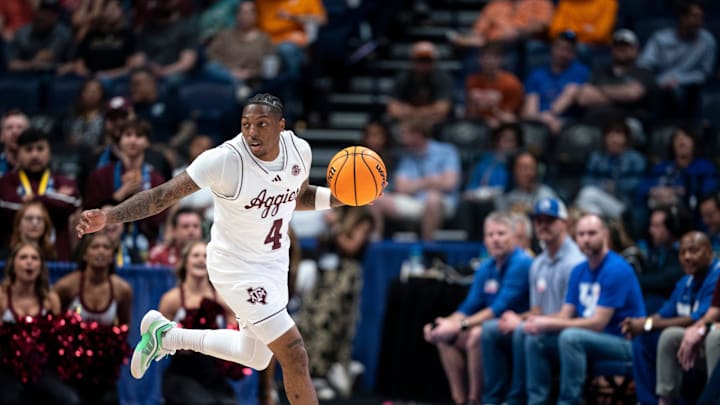 Texas A&M Aggies guard Wade Taylor IV brings the ball up court against Texas