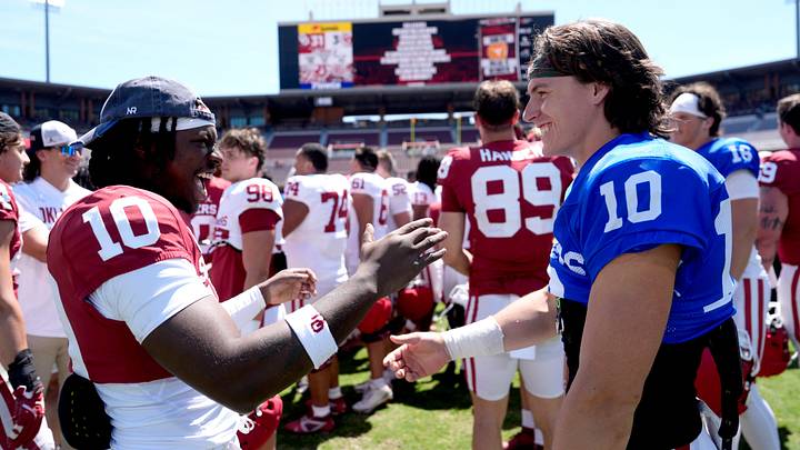 Oklahoma's Kip Lewis (10) and John Mateer (10) greet following during the University of Oklahoma Sooners Spring Game at the Gaylord Family - Oklahoma Memorial Stadium in Norman, Okla., Saturday April 18, 2026. Oklahoma's Kip Lewis (10) and John Mateer (10) greet following during the University of Oklahoma Sooners Spring Game at the Gaylord Family - Oklahoma Memorial Stadium in Norman, Okla., Saturday April 18, 2026.