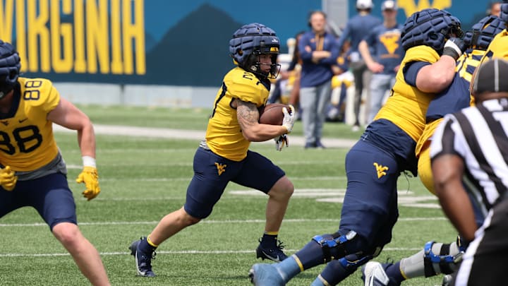 West Virginia freshman running back Clay Ash looks for a crease in the Gold-Blue Spring Game.