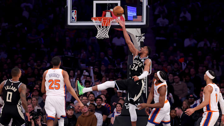 Jan 12, 2025; New York, New York, USA; Milwaukee Bucks forward Giannis Antetokounmpo (34) drives to the basket against New York Knicks forwards Precious Achiuwa (5) and Mikal Bridges (25) during the first quarter at Madison Square Garden. Mandatory Credit: Brad Penner-Imagn Images Jan 12, 2025; New York, New York, USA; Milwaukee Bucks forward Giannis Antetokounmpo (34) drives to the basket against New York Knicks forwards Precious Achiuwa (5) and Mikal Bridges (25) during the first quarter at Madison Square Garden. Mandatory Credit: Brad Penner-Imagn Images