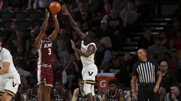 Nov 12, 2025; Nashville, Tennessee, USA;  Eastern Kentucky Colonels guard Tyler Jackson (2) shoots over  Vanderbilt Commodores guard Duke Miles (2) as the shot clock runs out during the second half at Memorial Gymnasium. Mandatory Credit: Steve Roberts-Imagn Images
