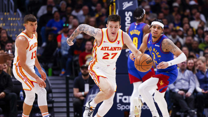 Apr 6, 2024; Denver, Colorado, USA; Atlanta Hawks guard Vit Krejci (27) drives down the court against the Denver Nuggets in the second half at Ball Arena. Mandatory Credit: Michael Ciaglo-USA TODAY Sports