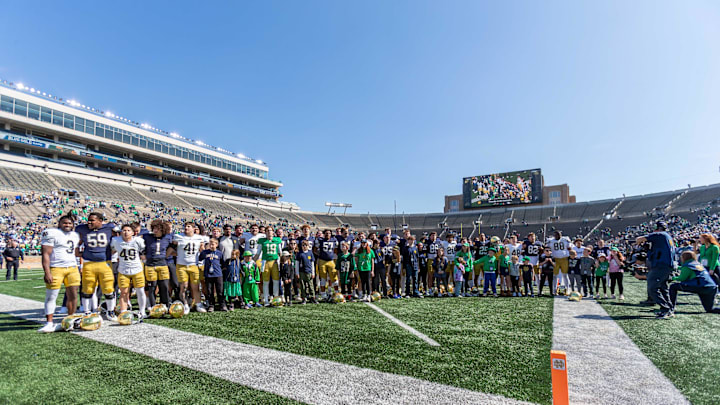 Apr 12, 2025; Notre Dame, IN, USA; Notre Dame players and guests line up for the alma mater during the Blue-Gold game at Notre Dame Stadium. Mandatory Credit: Michael Caterina-Imagn Images