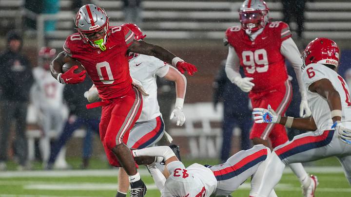 Baylor's David Gabriel Georges (0) leaps over Brentwood Academy's Hill Strong (43) during the Division II-AAA championship game at Finley Stadium in Chattanooga, Tenn., on Dec. 4, 2025. Baylor's David Gabriel Georges (0) leaps over Brentwood Academy's Hill Strong (43) during the Division II-AAA championship game at Finley Stadium in Chattanooga, Tenn., on Dec. 4, 2025.