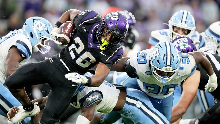 Aug 29, 2026; Dublin, Co. Dublin, IRL;  TCU Horned Frogs running back Jeremy Payne (26) breaks the tackle of North Carolina Tar Heels defensive back Kaleb Cost (2) in the second half at Aviva Stadium.  Mandatory Credit: Laszlo Geczo-Imagn Images