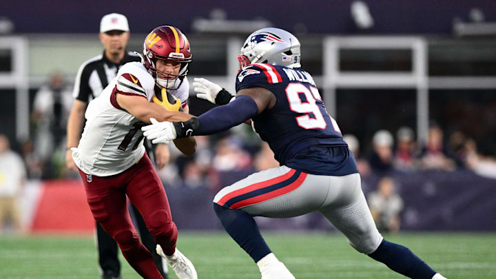 Aug 8, 2025; Foxborough, Massachusetts, USA; New England Patriots defensive end Milton Williams (97) tackles Washington Commanders wide receiver Luke McCaffrey (11) during the first half at Gillette Stadium. Mandatory Credit: Brian Fluharty-Imagn Images