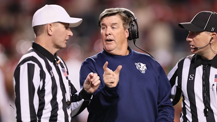 Nov 18, 2023; Fayetteville, Arkansas, USA; FIU Panthers head coach Mike MacIntyre talks to officials during the first half against the Arkansas Razorbacks at Donald W. Reynolds Razorback Stadium. Mandatory Credit: Nelson Chenault-Imagn Images