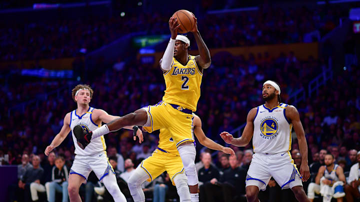 Apr 3, 2025; Los Angeles, California, USA; Los Angeles Lakers forward Jarred Vanderbilt (2) gets the rebound against the Golden State Warriors during the second half at Crypto.com Arena. Mandatory Credit: Gary A. Vasquez-Imagn Images