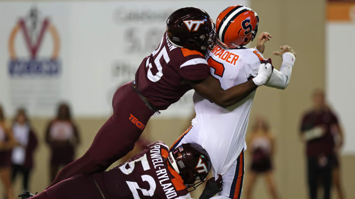 Oct 26, 2023; Blacksburg, Virginia, USA; Virginia Tech Hokies defensive linemanCole Nelson and defensive lineman Antwaun Powell-Ryland (52) sack Syracuse Orange quarterback Garrett Shrader (6) in the end zone for a safety during the third quarter at Lane Stadium. Mandatory Credit: Peter Casey-USA TODAY Sports