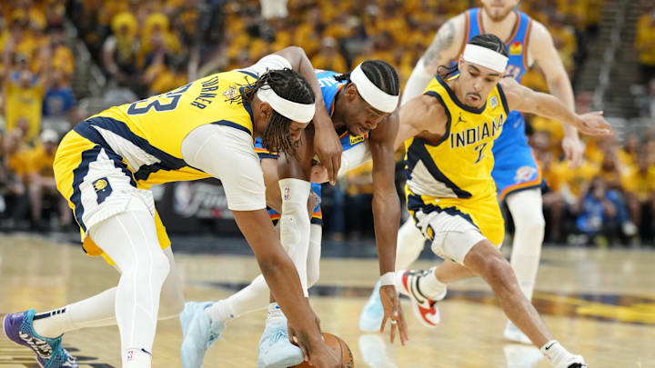 Jun 19, 2025; Indianapolis, Indiana, USA; Oklahoma City Thunder guard Shai Gilgeous-Alexander (2) battles for the ball against Indiana Pacers center Myles Turner (33) and guard Andrew Nembhard (2) during the first half of game six of the 2025 NBA Finals between the Oklahoma City Thunder and the Indiana Pacers at Gainbridge Fieldhouse. Mandatory Credit: Kyle Terada-Imagn Images
