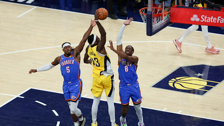 Jun 19, 2025; Indianapolis, Indiana, USA; Indiana Pacers forward Pascal Siakam (43) shoots the ball defended by Oklahoma City Thunder guard Luguentz Dort (5) and Oklahoma City Thunder forward Jalen Williams (8) in the second quarter during game six of the 2025 NBA Finals at Gainbridge Fieldhouse. Mandatory Credit: Trevor Ruszkowski-Imagn Images