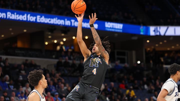 Feb 26, 2025; Memphis, Tennessee, USA; Memphis Tigers guard PJ Haggerty (4) shoots the ball against the Rice Owls during the first half at FedExForum. Mandatory Credit: Wesley Hale-Imagn Images