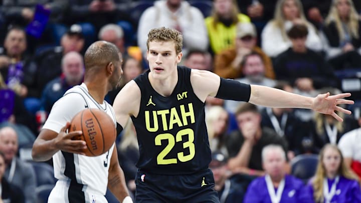 Nov 26, 2024; Salt Lake City, Utah, USA; San Antonio Spurs guard Chris Paul (3) dribbles the ball around Utah Jazz forward/center Lauri Markkanen (23) during the first half at the Delta Center. Mandatory Credit: Christopher Creveling-Imagn Images