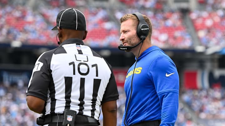 Sep 14, 2025; Nashville, Tennessee, USA; Los Angeles Rams head coach Sean McVay talks with line judge Carl Johnson (101) about throwing the challenge flag against the Tennessee Titans during the second half at Nissan Stadium. Mandatory Credit: Steve Roberts-Imagn Images Sep 14, 2025; Nashville, Tennessee, USA; Los Angeles Rams head coach Sean McVay talks with line judge Carl Johnson (101) about throwing the challenge flag against the Tennessee Titans during the second half at Nissan Stadium. Mandatory Credit: Steve Roberts-Imagn Images