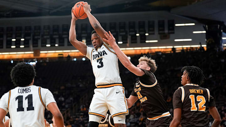 Iowa forward Cam Manyawu (3) secures a rebound against Western Michigan center Declan Peterson (22) Dec. 14, 2025 at Carver-Hawkeye Arena in Iowa City, Iowa. Iowa forward Cam Manyawu (3) secures a rebound against Western Michigan center Declan Peterson (22) Dec. 14, 2025 at Carver-Hawkeye Arena in Iowa City, Iowa.