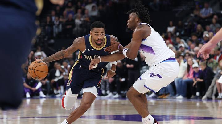Oct 23, 2026; Salt Lake City, Utah, USA;  New Orleans Pelicans guard Dejounte Murray (5) drives against Utah Jazz guard Isaiah Collier (8) during the first half at Delta Center.  Mandatory Credit: Rob Gray-Imagn Images