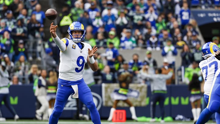 Nov 3, 2024; Seattle, Washington, USA; Los Angeles Rams quarterback Matthew Stafford (9) passes against the Seattle Seahawks during the first quarter at Lumen Field. Mandatory Credit: Joe Nicholson-Imagn Images