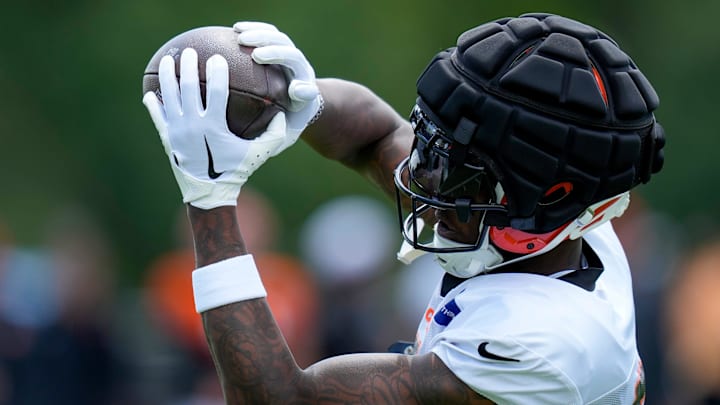 Cincinnati Bengals wide receiver Tee Higgins (5) pulls in a pass during a preseason joint practice at the Paycor Stadium practice facility in downtown Cincinnati on Tuesday, Aug. 20, 2024.