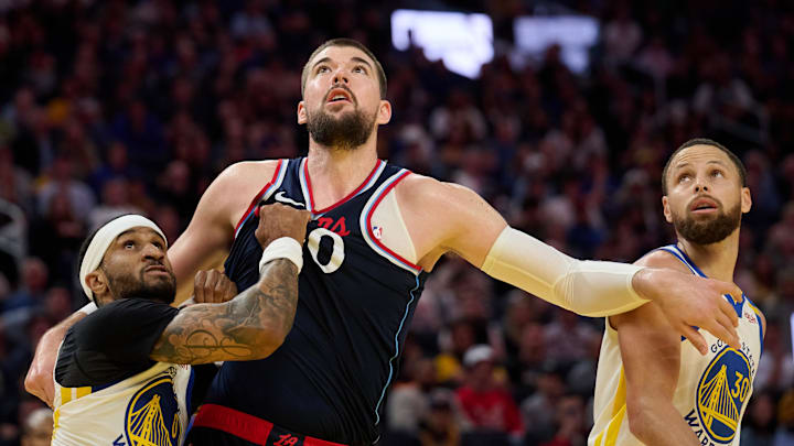 Apr 13, 2025; San Francisco, California, USA; Golden State Warriors guard Gary Payton II (0) and guard Stephen Curry (30) vie for position against LA Clippers center Ivica Zubac (40) during the fourth quarter at Chase Center. Mandatory Credit: Robert Edwards-Imagn Images